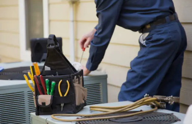 HVAC technician inspecting a residential HVAC system in California