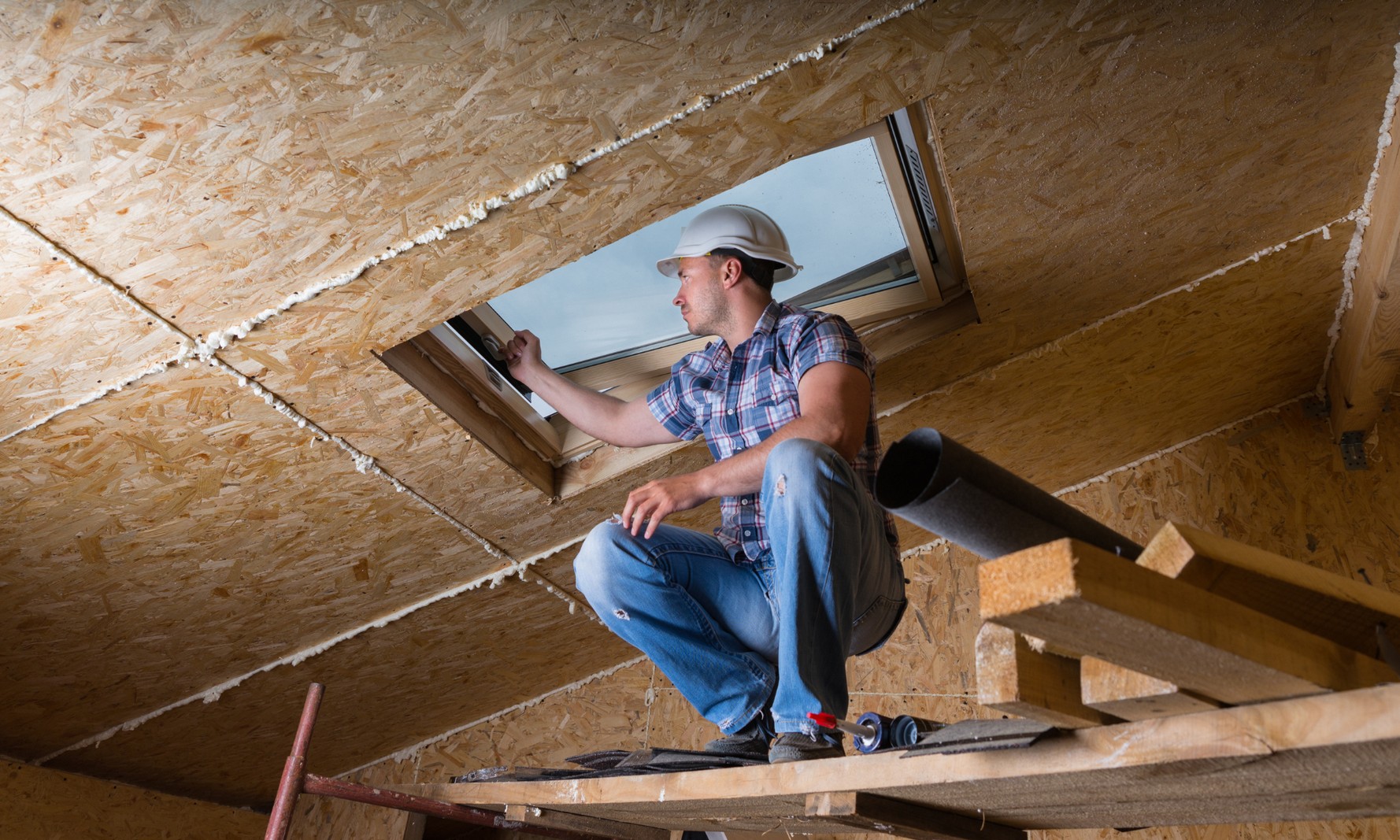 Attic insulation contractor in California assessing attic conditions before attic insulation installation in California.