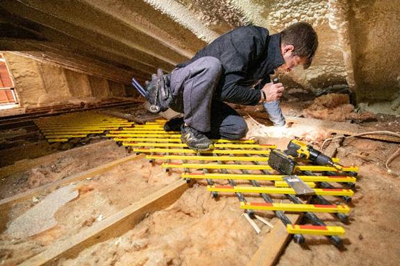 Spacious attic insulation in California before insulation upgrades