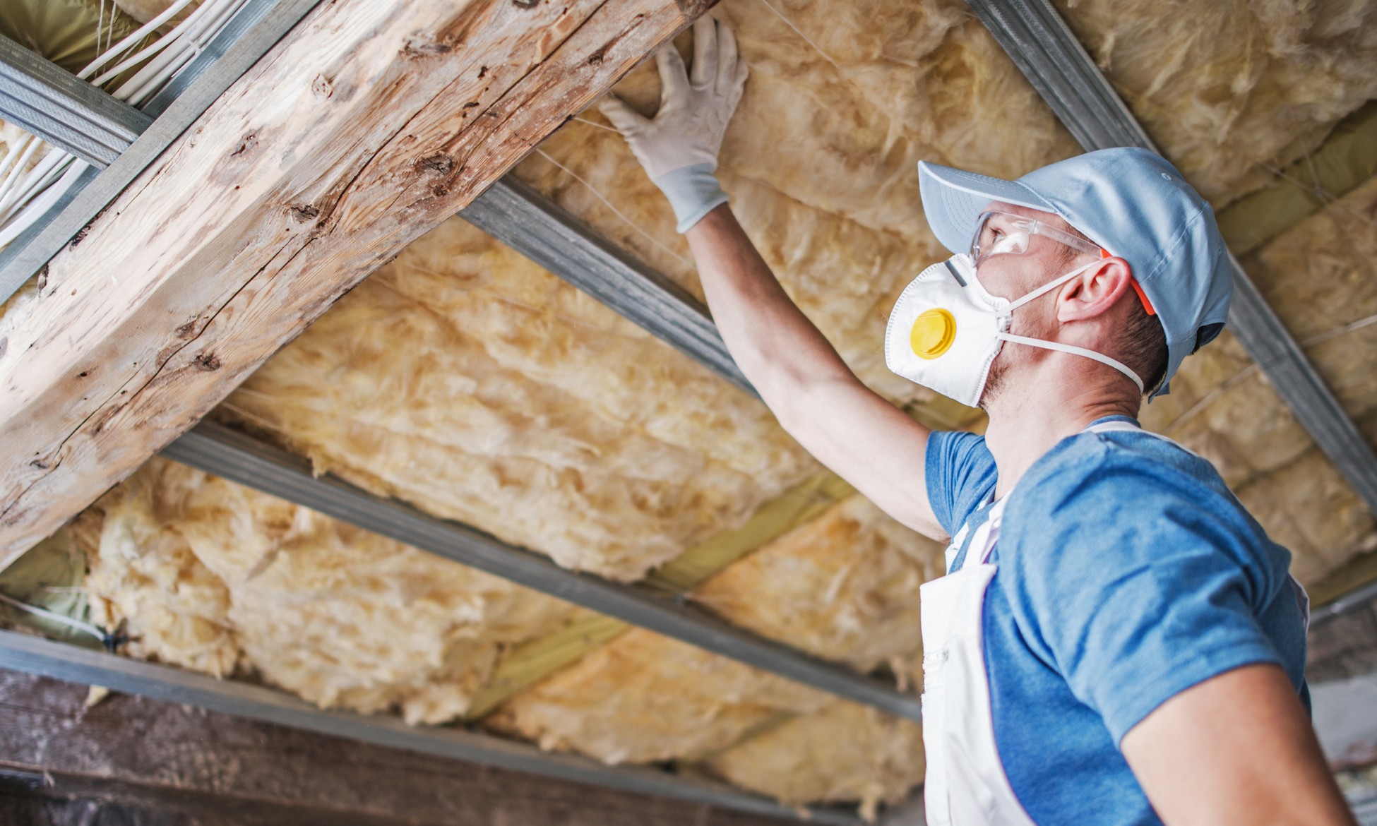 Professional attic insulation installation in California home attic.