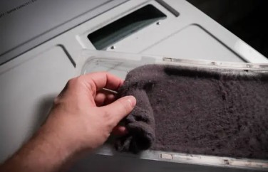 Lint buildup affecting dryer vent airflow