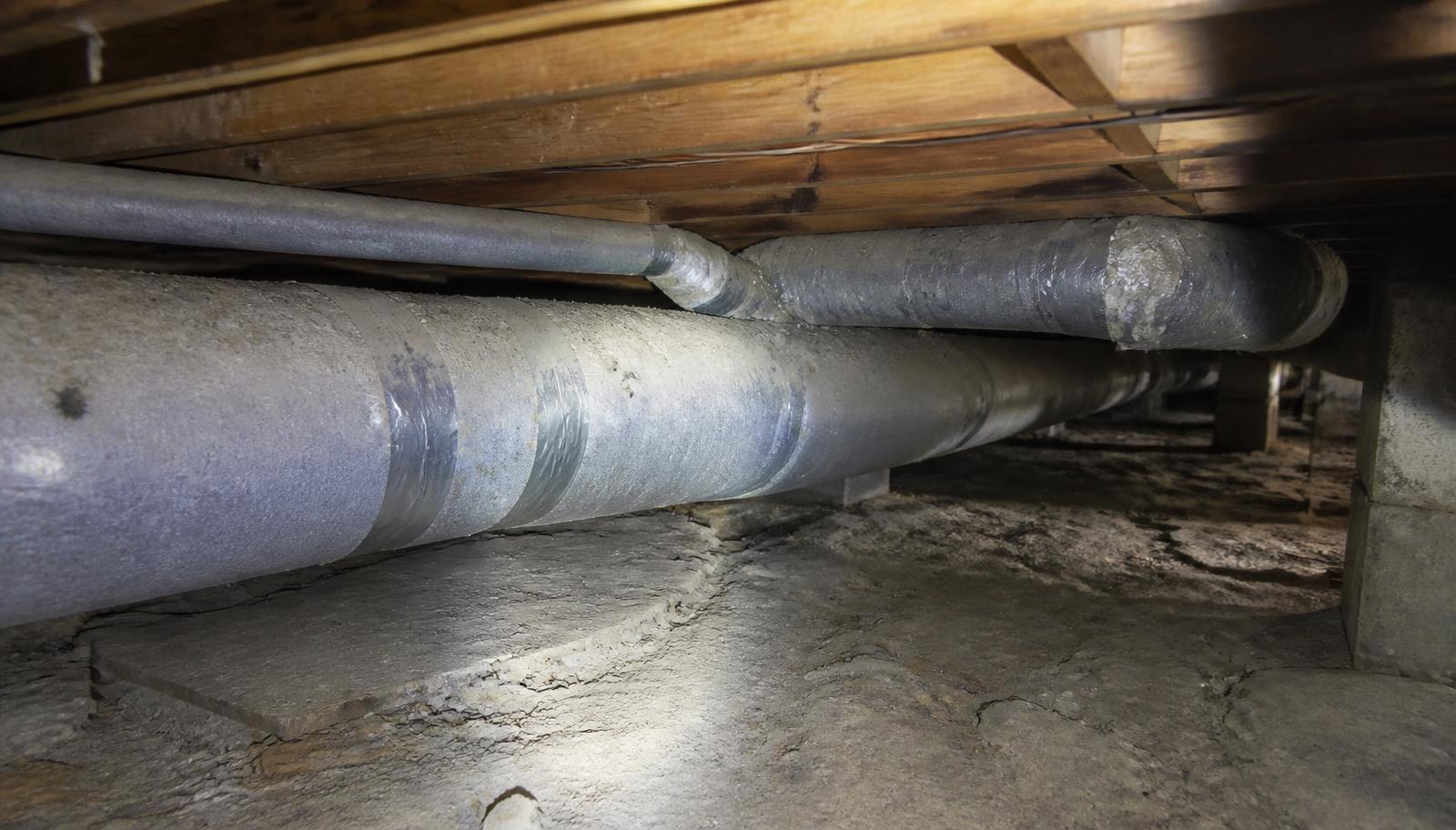 Aging insulated ductwork running through the crawlspace of an older Hughson, CA home